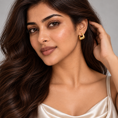 Avni Sculptural Huggie Earrings — angled model close-up