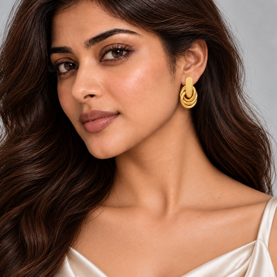 Inaya Intertwined Loop Earrings — model close-up